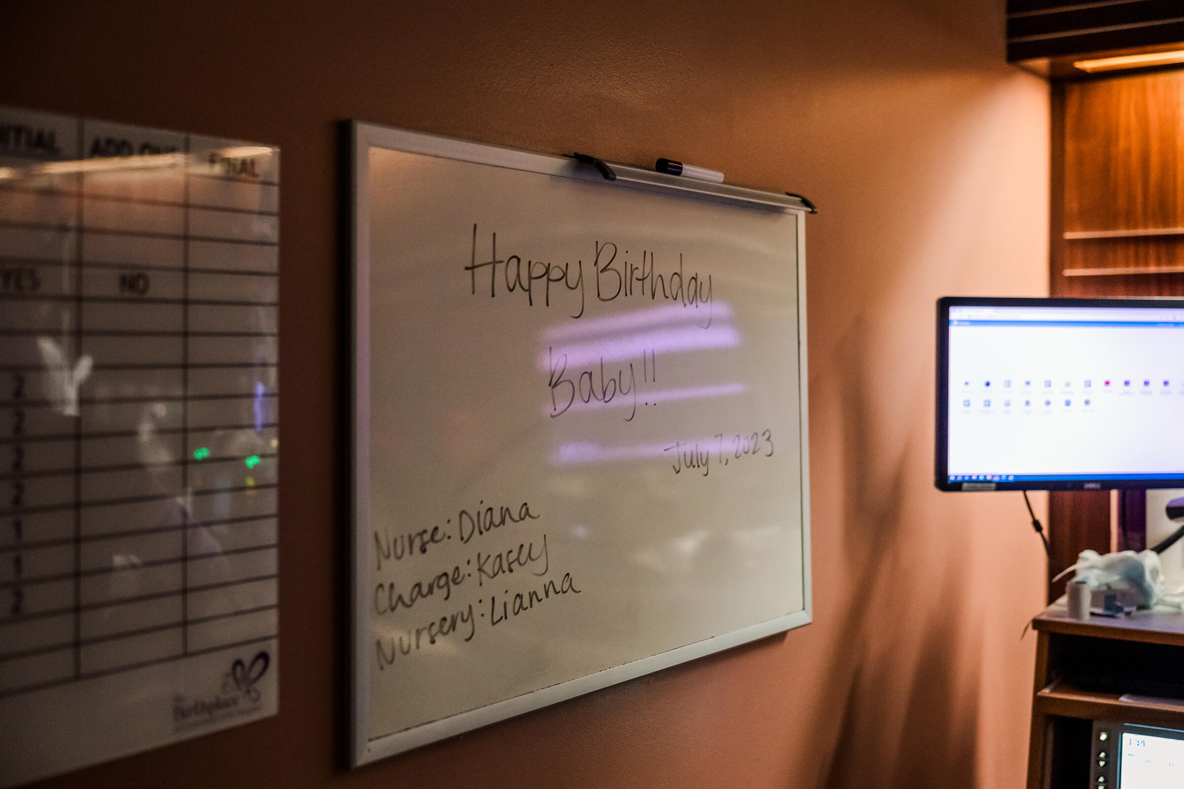 white board with patient information in a labor and delivery room