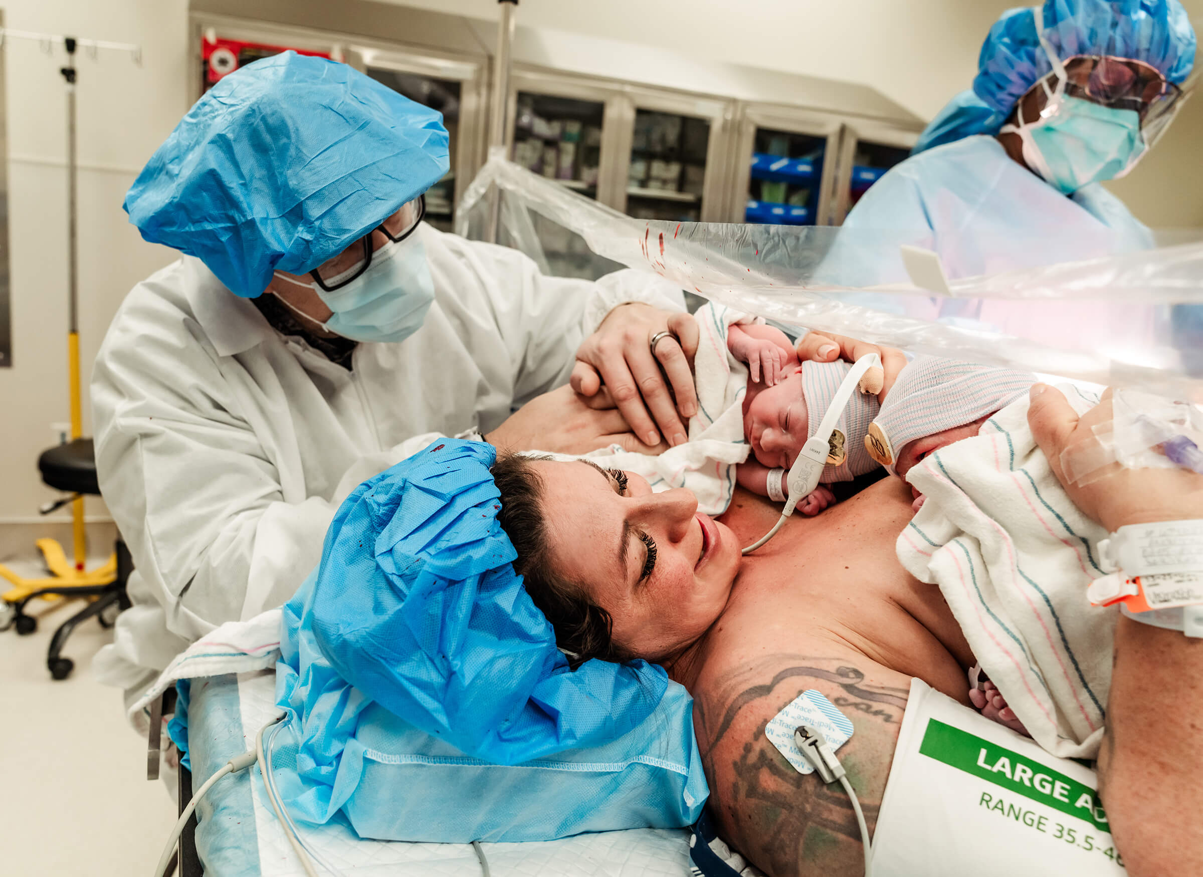 mother bonding with her twins skin-to-skin in the operating room at Summerlin Hospital