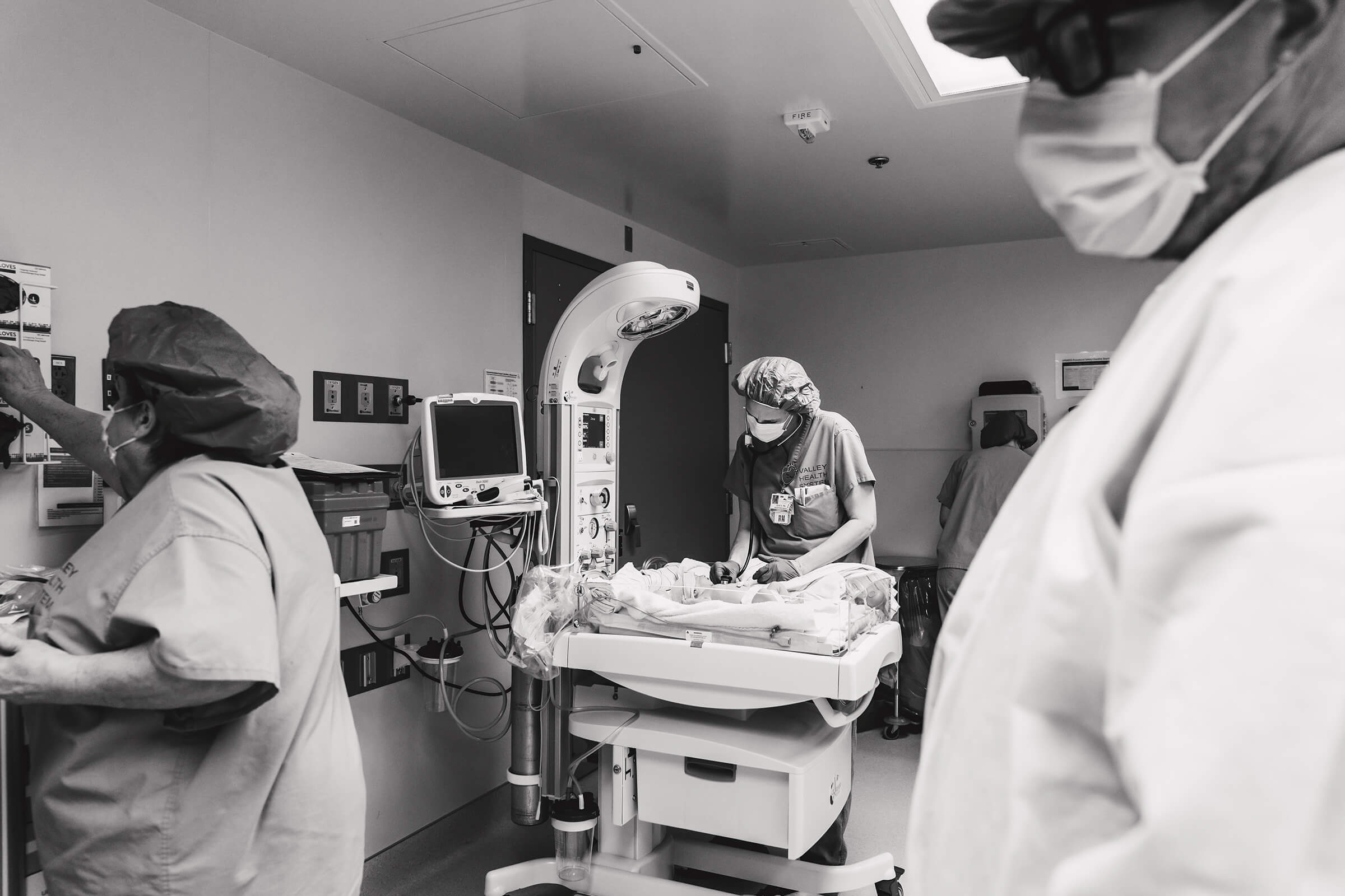 nurse performing newborn exam in the operating room