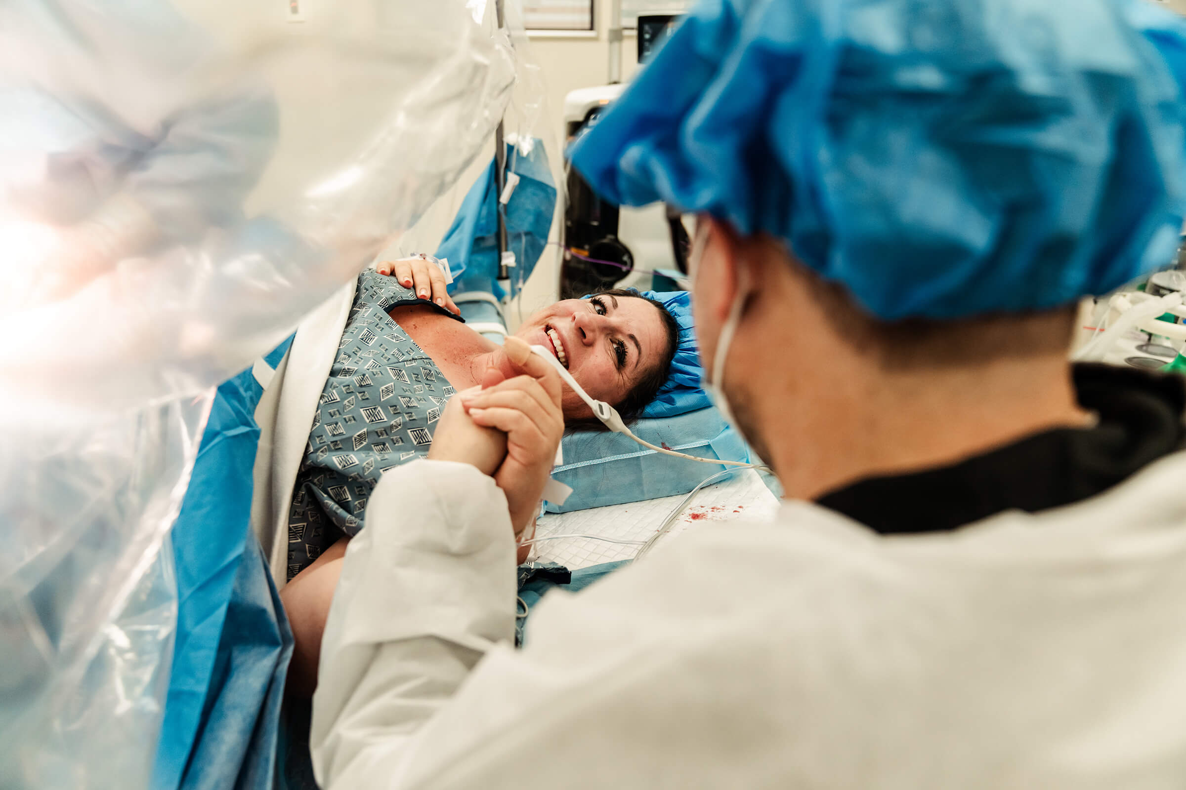 parents connect while surgery is being performed for a twin birth