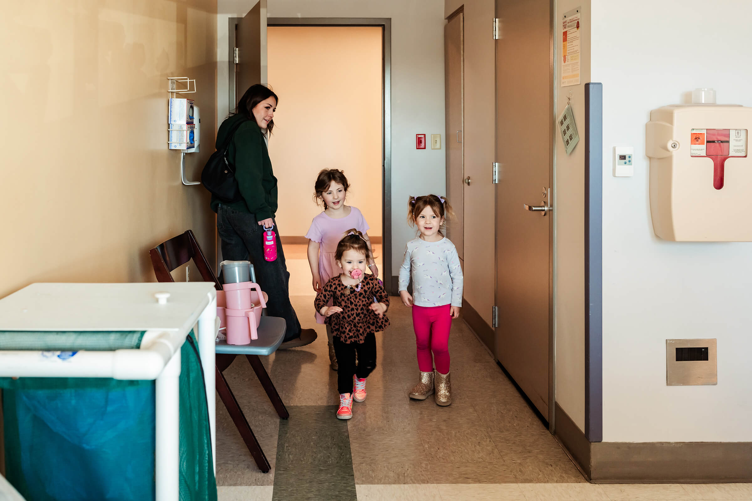 Siblings arriving at the hospital to meet their twin baby sisters