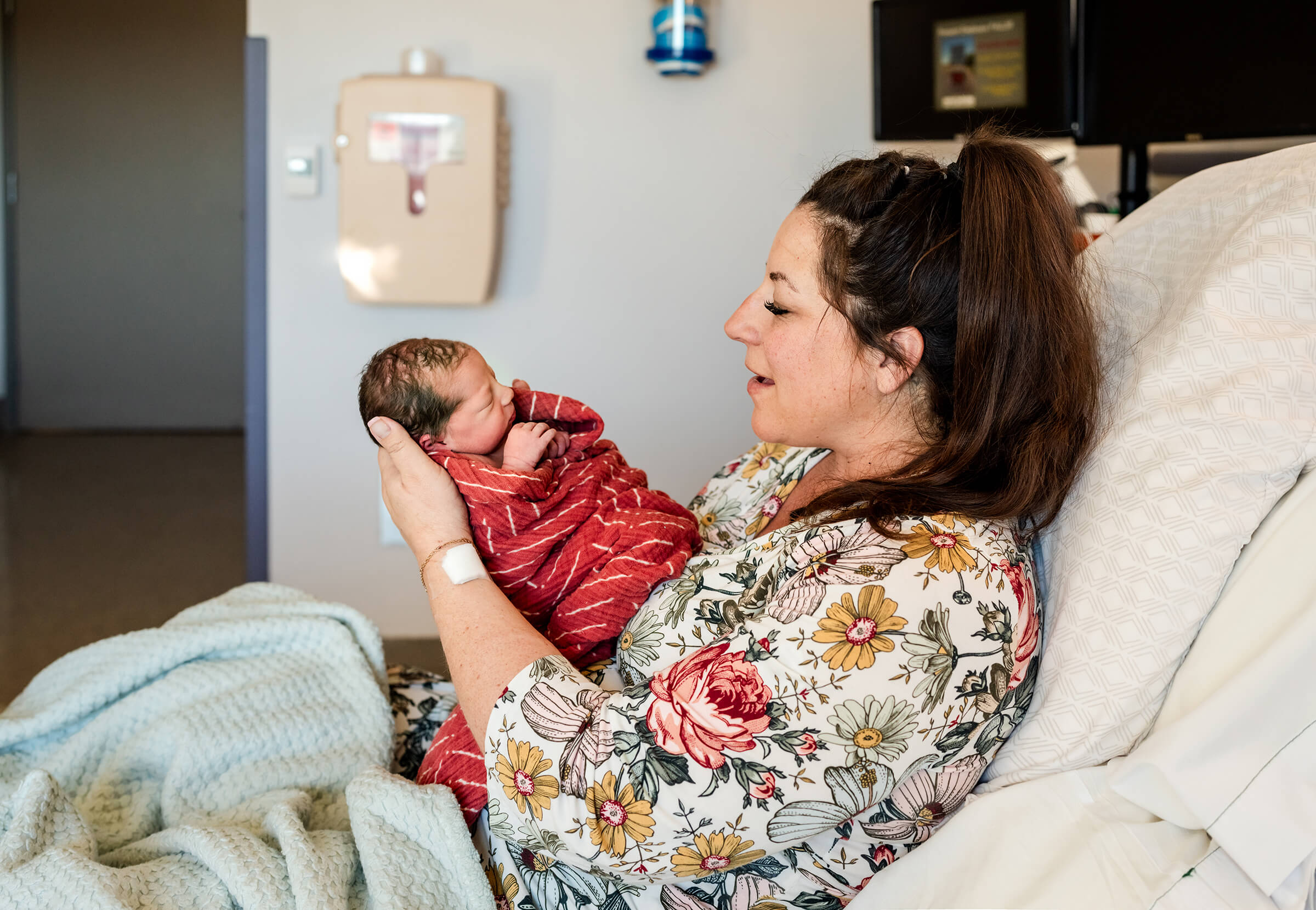 mom holding her baby during a Fresh session in Las Vegas